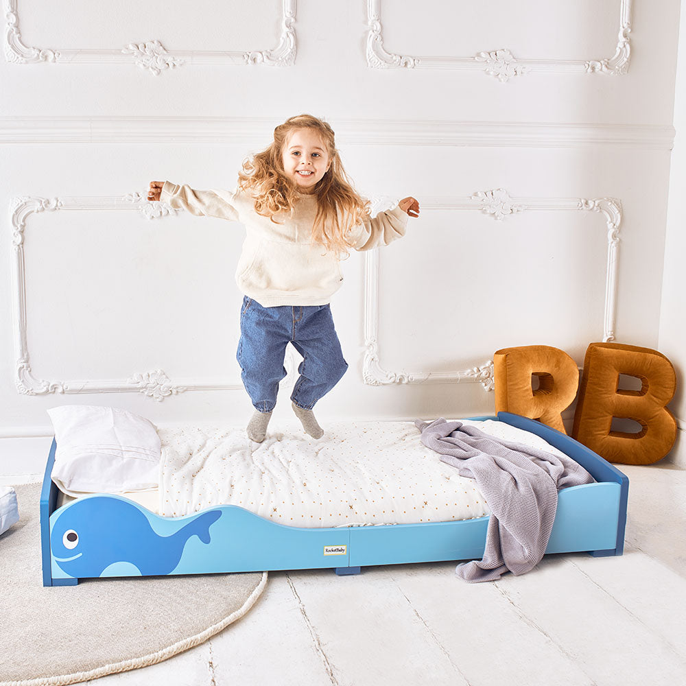 Children playing on floor bed