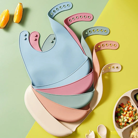 Bavaglino in silicone per neonati con tasca multivariante