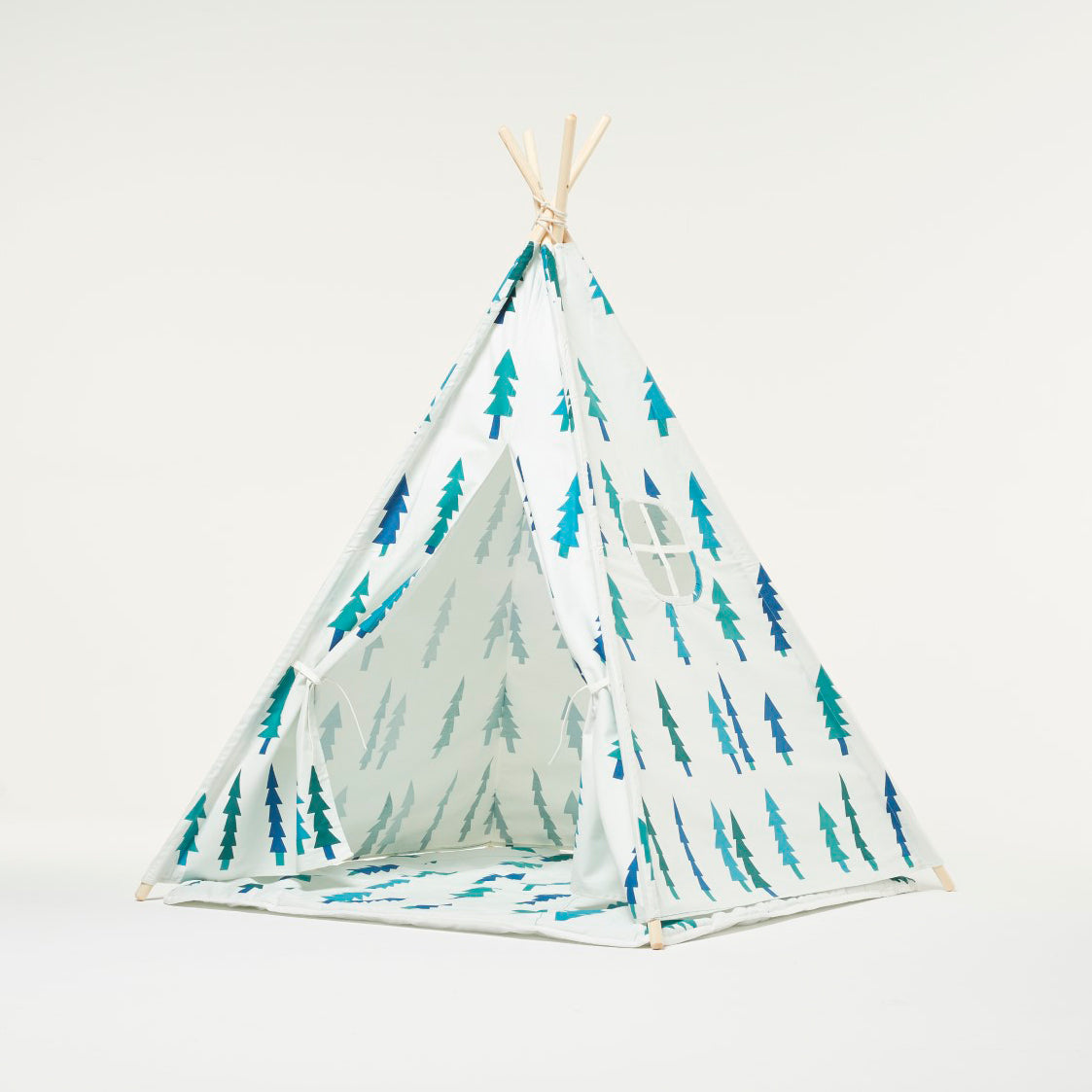 Tienda de juegos tipi blanca con árboles y cojín